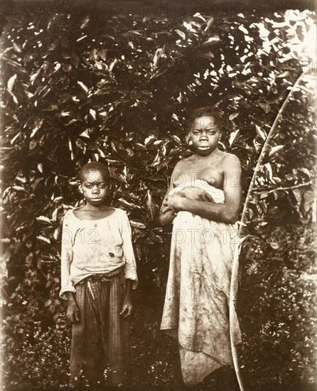 Inhabitants of Bioko. Portrait of a young woman and a boy, inhabitants of the island of Bioko. Bioko, Equatorial Guinea, circa 1930., Bioko Norte, Equatorial Guinea, Central Africa, Africa.