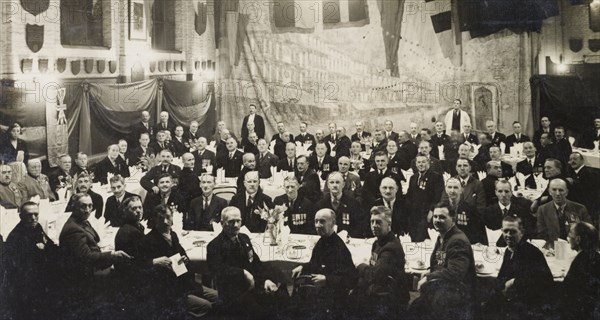 Defenders of Ladysmith' dinner, 1934. Members of the 'Defenders of Ladysmith Association' sit around long tables at their annual dinner. Each year in February or early March, the association gathered to commemorate the Siege of Ladysmith (1899-1900), a prominent battle of the Second Boer War (1899-1902). Probably Manchester, England, 1934. Manchester, Greater Manchester, England (United Kingdom), Western Europe, Europe .