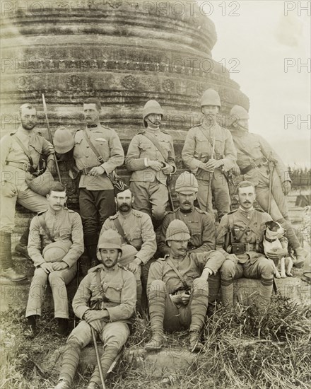 British Army officers in Wuntho. British Army officers pose informally at the the base of a carved stone 'zeidi' or pagoda at Wuntho. The group are pictured shortly after British forces captured Wuntho following a conflict with Burmese rebels. Wuntho, Burma (Myanmar), 1891. Wuntho, Sagaing, Burma (Myanmar), South East Asia, Asia.