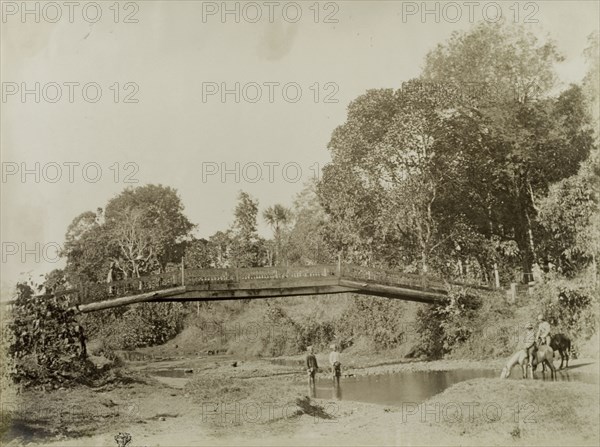 Wolseley and Smyth at Wuntho. Horses ridden by General Wolseley and Major Smyth drink from a shallow river that flows beneath a bridge. Both officers led British Army troops against Burmese rebels during a conflict at Wuntho. Wuntho, Burma (Myanmar), 1891. Wuntho, Sagaing, Burma (Myanmar), South East Asia, Asia.