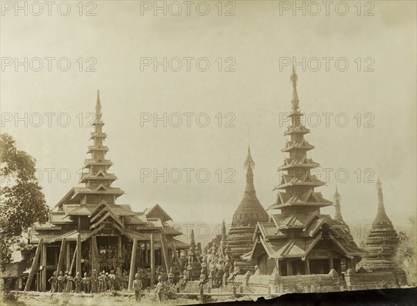 The Oxfordshire Light Infantry at Wuntho. British Army officers from the Oxfordshire Light Infantry pose outside Wuntho Palace and the town's 'Pon-gyi kyaunga' (Buddhist monastery). The group are pictured shortly after British forces captured Wuntho following a conflict with Burmese rebels. Wuntho, Burma (Myanmar), 1891. Wuntho, Sagaing, Burma (Myanmar), South East Asia, Asia.