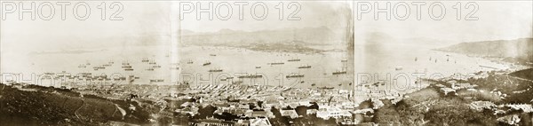 View across Victoria Harbour. View over Victoria Harbour, looking across to the Kowloon peninsula. A variety of vessels are visible, ranging from British naval ships to Chinese sampans. Hong Kong, China, circa 1904. Hong Kong, Hong Kong, China, People's Republic of, Eastern Asia, Asia.