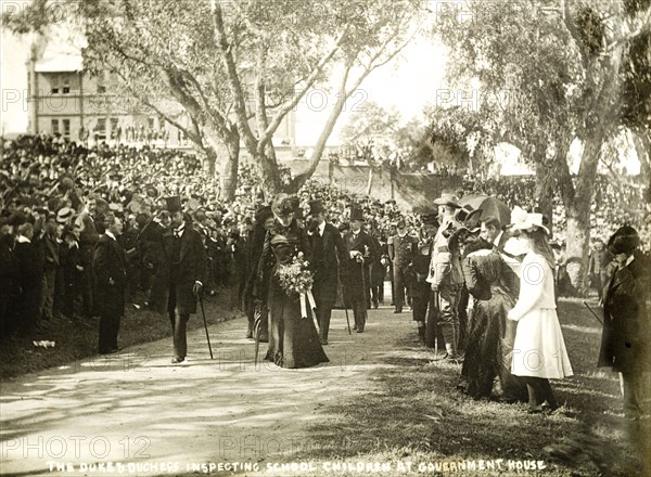 The Duke and Duchess inspect school children, Perth. Crowds of spectators watch as the Duke and Duchess of Cornwall and York (later King George V and Queen Mary) inspect school children in the grounds of Government House. Perth, Australia, 25 July 1901. Perth, West Australia, Australia, Australia, Oceania.