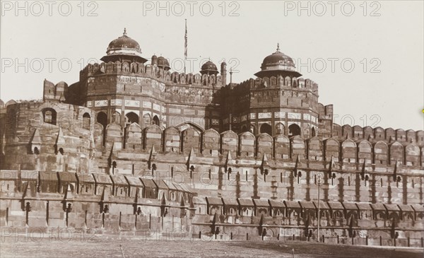 The Dehli Gate at Agra Fort. Exterior view of the Dehli Gate at the Agra Fort complex. The grand entrance is crowned with two domed towers that stand over the fortress' bastioned enclosure wall. Agra, United Provinces (Uttar Pradesh), India, circa 1922. Agra, Uttar Pradesh, India, Southern Asia, Asia.