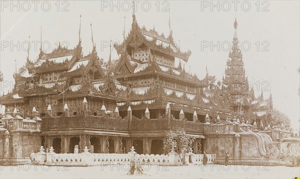 Shwenandaw Monastery in Mandalay. Exterior shot of the multi-tiered Shwenandaw Monastery, built by King Mindon at Mandalay Hill during the 19th century. Built in traditional Burmese style, the monastery is known for the intricate teak carvings of Buddhist myths that cover its parapets and balustrades. Mandalay, Burma (Myanmar), circa 1926. Mandalay, Mandalay, Burma (Myanmar), South East Asia, Asia.