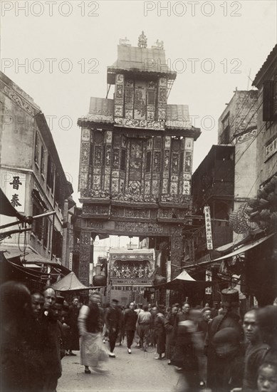 Welcome arch for the Duke of Connaught, Hong Kong. A decorative welcome arch spans a city street in honour of the Duke of Connaught, who visited Hong Kong shortly before a devastating typhoon struck the city on 18 September. Hong Kong,China, August 1906. Hong Kong, Hong Kong, China, People's Republic of, Eastern Asia, Asia.