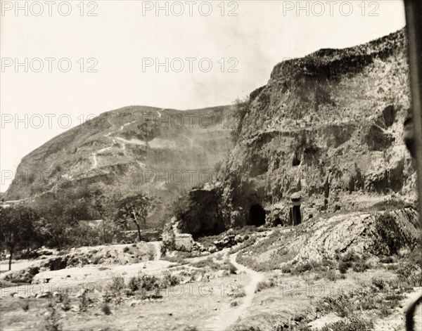 Cave dwellings on the banks of the Yellow River. A number of cave dwellings, built into a cliff face on the banks of the Yellow River. Central China, circa 1910. China, People's Republic of, Eastern Asia, Asia.