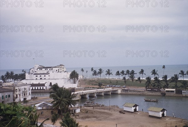 Fishing harbour behind Elmina Castle. The fishing harbour behind Elmina Castle, viewed from Fort St Jago on an adjacent hilltop. Elmina, Ghana, circa 1959. Elmina, Central (Ghana), Ghana, Western Africa, Africa.