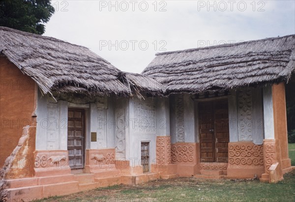 Reconstruction of a fetish priest's house. A life-size reconstruction of a fetish priest's house at Accra Museum. Accra, Ghana, circa 1960. Accra, East (Ghana), Ghana, Western Africa, Africa.