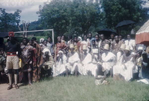 Priests at the Ngmayem festival. Priests dressed in white sit in a group at an annual Ngmayem harvest festival celebrated by the Manya Krobo people. Odumasi, Ghana, circa 1960. Odumasi, East (Ghana), Ghana, Western Africa, Africa.