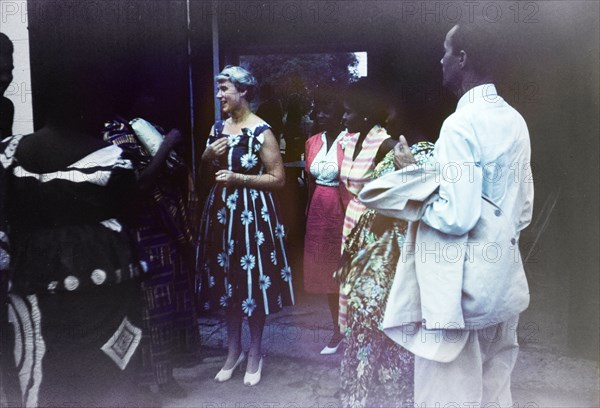 Wilma Gladstone's farewell party. A European woman chats to a group of Ghanaian friends at a farewell party for Wilma Gladstone, a British Principal Education Officer who retired to Scotland after a long career in the Gold Coast education service. Saltpond, Ghana, July 1961. Saltpond, West (Ghana), Ghana, Western Africa, Africa.