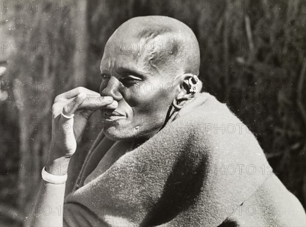 A Kikuyu elder. Portrait of a Kikuyu elder who was once a warrior. An original caption explains he was not yet a member of the elders' council, but ?served as a sort of lieutenant to the Chief?. South Nyeri, Kenya, 1936. Nyeri, Central (Kenya), Kenya, Eastern Africa, Africa.