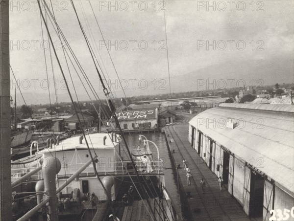 Kingston Harbour, Jamaica. View over the docks at Kingston Harbour, showing the roof of a 'Myer's Rum' warehouse. Kingston, Jamaica, circa 1935. Kingston, Kingston, Jamaica, Caribbean, North America .