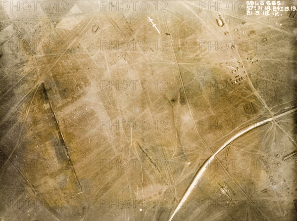 Aerial view of a military balloon camp. One of a series of British aerial reconnaissance photographs recording the positions of trenches on the Western Front during the First World War. An original caption identifies the white oblong shape in the top right hand corner as an observational kite balloon, and points out a military camp a little further down the same road. Nord-Pas de Calais or Picardie, France, 21 March 1918., Picardie, France, Western Europe, Europe .