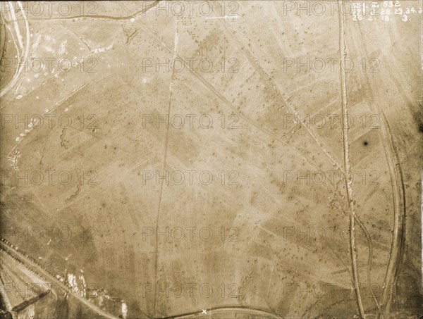 Aerial view of a bomb-damaged landscape. One of a series of British aerial reconnaissance photographs recording the positions of trenches on the Western Front during the First World War. A patchwork of fields is pockmarked with bomb craters. Nord-Pas de Calais or Picardie, France, 26 February 1918., Nord-Pas de Calais, France, Western Europe, Europe .