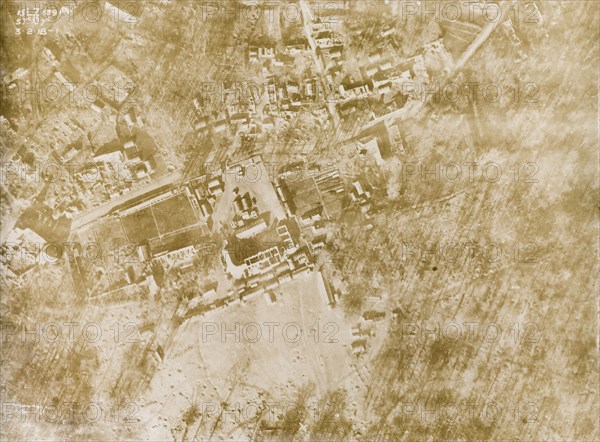 Aerial view of a bomb-damaged village. One of a series of British aerial reconnaissance photographs recording the positions of trenches on the Western Front during the First World War. A small French village lies in ruins, riddled with bomb craters, after suffering a continuous barrage of artillery fire. Nord-Pas de Calais or Picardie, France, 3 February 1918., Nord-Pas de Calais, France, Western Europe, Europe .