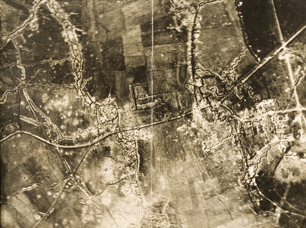 Trenches and bomb damage on the Western Front. One of a series of British aerial reconnaissance photographs recording the positions of trenches on the Western Front during the First World War. A complex trench system is surrounded by fields riddled with bomb craters. This appears to be a stretch of no man's land with two front line trenches facing each other. Nord-Pas de Calais or Picardie, France, circa 1918., Nord-Pas de Calais, France, Western Europe, Europe .