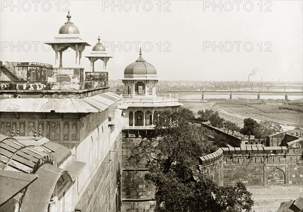 Musamman Burj at Agra Fort. View along the red sandstone wall of Agra Fort looking towards the Musamman Burj, an octagonal tower with an open pavillon. Agra, United Provinces (Uttar Pradesh), India, circa 1920. Agra, Uttar Pradesh, India, Southern Asia, Asia.