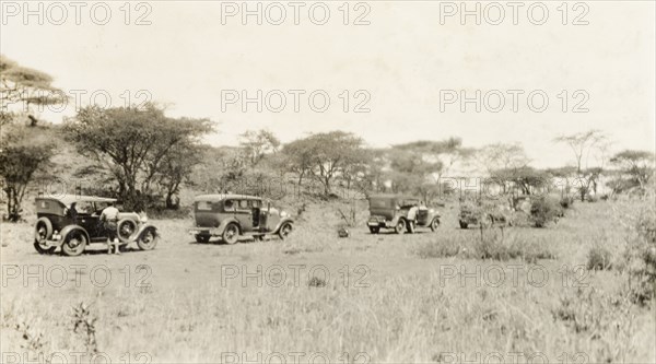 Leaving on a cross-Africa safari. A convoy of cars prepares to set out on a cross-Africa safari. An original caption comments: "They crossed the Sahara and ended up in Paris". Africa, 1928. Africa.