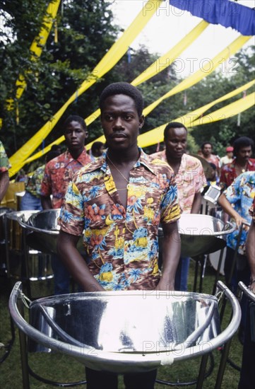 The Catelli All Stars. Trinidadian steel band, the Catelli All Stars, perform at a cultural festival held at the Commonwealth Institute. London, England, circa 1985. London, London, City of, England (United Kingdom), Western Europe, Europe .