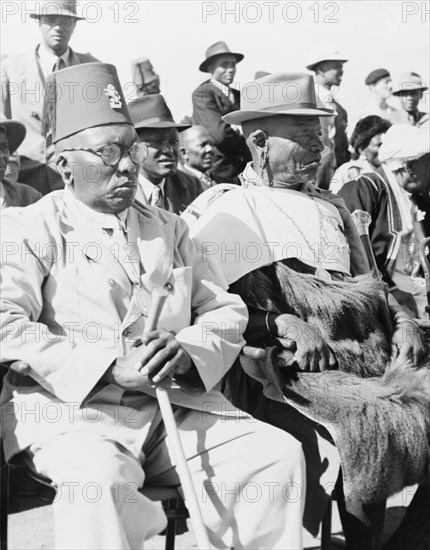 Awaiting the arrival of Princess Elizabeth. An assembly of African chiefs sit on a spectator stand as they await the arrival of Princess Elizabeth at Eastleigh Airport. Nairobi, Kenya, February 1952. Nairobi, Nairobi Area, Kenya, Eastern Africa, Africa.