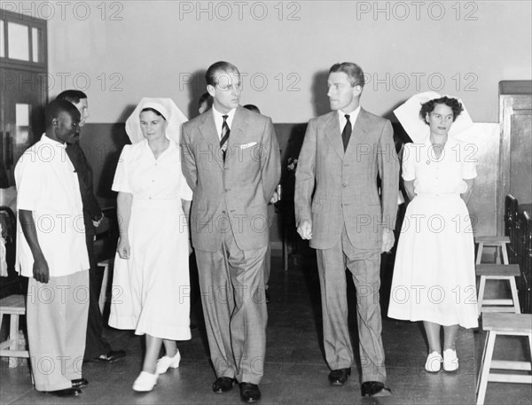 The Duke of Edinburgh at the King George VI Hospital. The Duke of Edinburgh accompanies Dr Gratton and two head nurses on a tour of the wards at the King George VI Hospital (now Kenyatta National Hospital). Nairobi, Kenya, February 1952. Nairobi, Nairobi Area, Kenya, Eastern Africa, Africa.