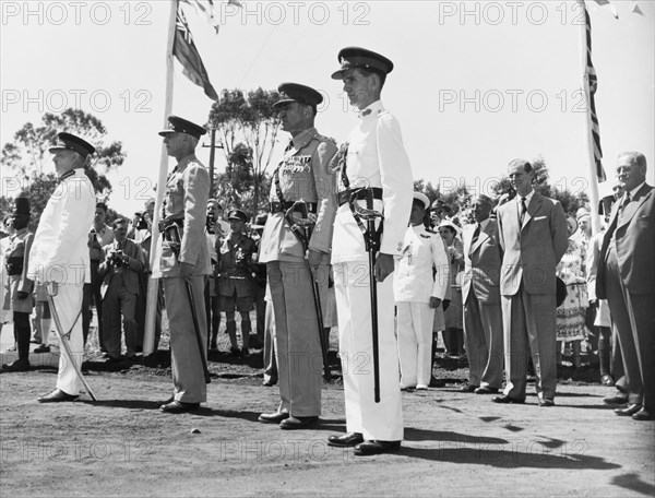 The Duke of Edinburgh at the Kenya Regiment headquarters. The Duke of Edinburgh watches as officers of the Kenya Regiment perform a drill at their military headquarters in Nairobi. Nairobi, Kenya, February 1952. Nairobi, Nairobi Area, Kenya, Eastern Africa, Africa.