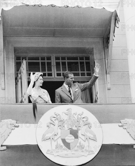 Princess Elizabeth and the Duke of Edinburgh at Nairobi City Hall. Princess Elizabeth and the Duke of Edinburgh wave to well-wishers from the balcony of Nairobi City Hall. Nairobi, Kenya, February 1952. Nairobi, Nairobi Area, Kenya, Eastern Africa, Africa.