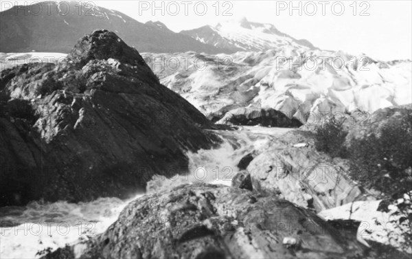 Mendenhall Glacier, Alaska. View of the Mendenhall Glacier, an expansive glacier extending from the Juneau Icefield to Mendenhall Lake. Originally known as Aak'wtaaksit in Tlingit, in 1892 it was renamed in honour of Thomas Corwin Mendenhall (1841-1924), superintendent of the U.S. Coast and Geodetic Survey from 1889-94. Near Juneau, Alaska, United States of America, circa 1931. Juneau, Alaska, United States of America, North America, North America .