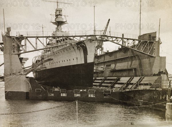 HMS Dauntless at Royal Navy dockyard, Bermuda. HMS Dauntless of the Royal Navy's South American Division dry-docked off the coast of Bermuda. Bermuda, circa 1931. Bermuda, Atlantic Ocean, Africa.