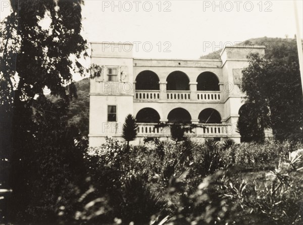 Cottage Hospital, Tortola. The facade of Cottage Hospital (now Peebles Hospital) in Road Town. The hospital was built in 1926 to replace an earlier building built under the direction of Major H.W. Peebles, Commissioner of the Virgin Islands (1919-1922), which was destroyed by a hurricane in 1924. Road Town, Tortola, British Virgin Islands, circa 1931. Road Town, Tortola, British Virgin Islands, Caribbean, North America .