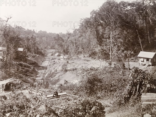 Railway track under construction in Caparo Valley. View over the construction of railway track 'No. 84' and a tunnel exit through Caparo Valley, part of the new Rio Claro railway line built by Trinidad Government Railways. Trinidad, circa 1912., Trinidad and Tobago, Trinidad and Tobago, Caribbean, North America .