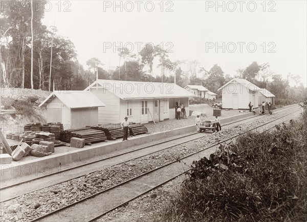 Longdenville railway station, Trinidad. Trinidad Government Railway workers complete Longdenville railway station, a stop on the new Rio Claro railway line. Longdenville, near Chaguanas, Trinidad, circa 1912. Chaguanas, Trinidad and Tobago, Trinidad and Tobago, Caribbean, North America .