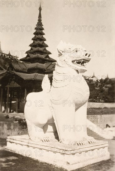 Lion statue at Shwe Dagon Pagoda. A statue of a lion outside a temple at the Shwe Dagon Pagoda. Rangoon, Burma (Yangon, Myanmar), 1931. Yangon, Yangon, Burma (Myanmar), South East Asia, Asia.