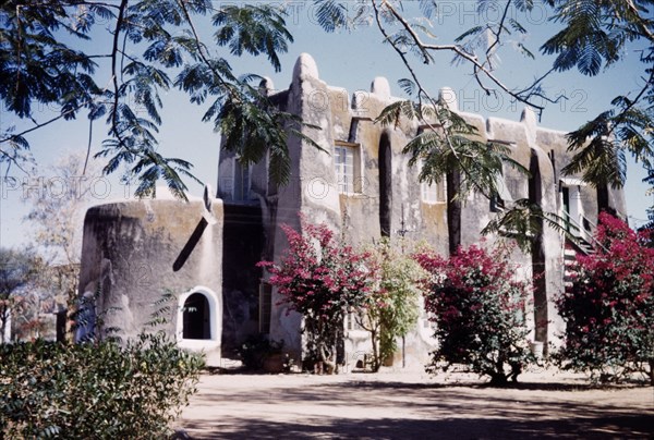 Mud building in Kano, Nigeria. View of the 'Old Residency' in Kano, a two-storey mud building originally built in 1910 and still in use at time of this photograph. Kano, Nigeria, 1963. Kano, Kano, Nigeria, Western Africa, Africa.