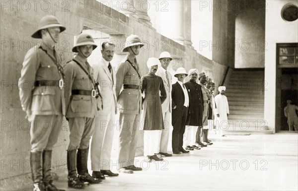 Line up of military personnel and dignitaries, India. Officers of the West Yorkshire Regiment (The Prince of Wales's Own) line up for a portrait with British and Indian dignitaries. Probably Indore State (Madhya Pradesh), India, 1928. Indore, Madhya Pradesh, India, Southern Asia, Asia.