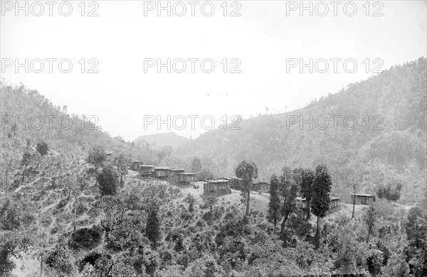 A Karen village. View of a Karen village set in a mountainous forest clearing. Burma (Myanmar), circa 1890. Burma (Myanmar), South East Asia, Asia.