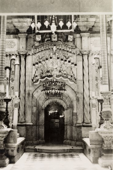 Tomb of Jesus, Jerusalem. View of the ornate aedicule marking the Tomb of Jesus inside the Church of the Holy Sepulchre, a Christian church believed to be built over Calvary (Golgotha), the hill on which Jesus was crucified. Jerusalem, British Mandate of Palestine (Israel), circa 1942. Jerusalem, Jerusalem, Israel, Middle East, Asia.