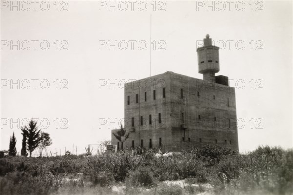 Fortified police building, Palestine. View of a large, fortified building with a projecting octagonal watchtower. This building was possibly used by British police forces as a gaol or police headquarters. British Mandate of Palestine (Middle East), circa 1942., Middle East, Asia.