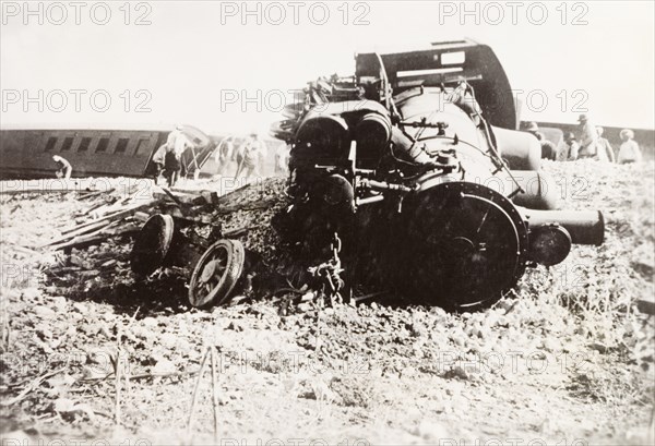 Derailed steam locomotive at Ras el Ain. A steam locomotive lies in pieces on a railway embankment, derailed in a sabotage attack by Palestinian Arab dissidents during the Great Uprising (1936-39). Ras el Ain, British Mandate of Palestine (Israel), circa 1938. Israel, Middle East, Asia.