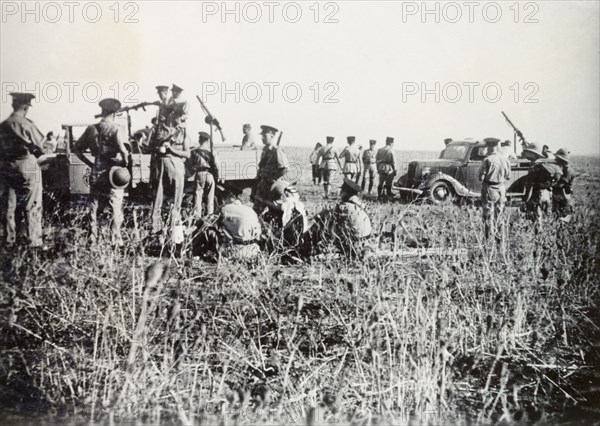 Scene of a railway incident, Lydda. British police and soldiers of the Royal Engineers gather at the scene of a railway crash, an act of sabotage committed by Palestinian Arab dissidents during the Great Uprising (1936-39). Lydda, British Mandate of Palestine (Lod, Israel), circa 1938. Lod, Central (Israel), Israel, Middle East, Asia.