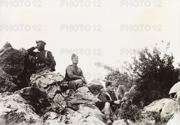 British soldiers man a look-out post, Palestine. British soldiers man a look-out post on a rocky outcrop in the Palestinian countryside. During the period of the Great Uprising (1936-39), an additional 20,000 British troops were deployed to Palestine in an attempt to clamp down on Arab dissidence. British Mandate of Palestine (Middle East), circa 1938., Middle East, Asia.