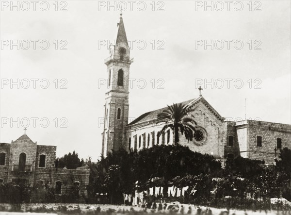 Catholic church in Jaffa. View of a spired Catholic church in Jaffa. Jaffa, British Mandate of Palestine (Israel), circa 1938. Jaffa, Tel Aviv, Israel, Middle East, Asia.