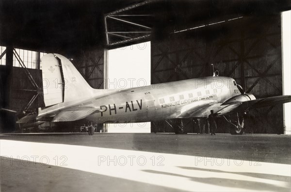 A KLM Royal Dutch Airlines aeroplane. A KLM Royal Dutch Airlines aeroplane, the PH-ALV 'Valk', sits in a hangar in Lydda Airport. Lydda, British Mandate of Palestine (Lod, Israel), circa 1938. Lod, Central (Israel), Israel, Middle East, Asia.