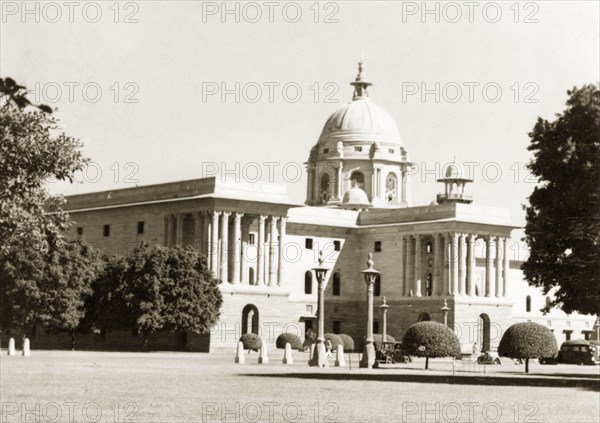 Secretariat building, Delhi. The Secretariat building in Delhi, one of a set of two buildings designed by British architect Sir Herbert Baker to accompany the Rashtrapati Bhavan (the official residence of the President of India). Built between 1912 to 1931 in a combination of Mughal and Rajputana architectural styles, the building is now used as Indian Government offices. Delhi, India, 1941. Delhi, Delhi, India, Southern Asia, Asia.
