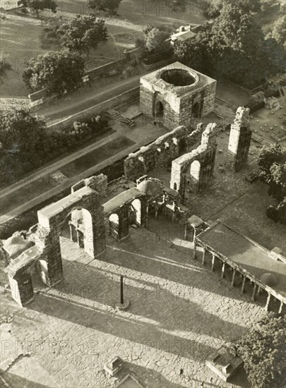 The Qutb Minar complex, Delhi. View over the Qutb Minar complex from the Qutb Minar tower, showing the Iron Pillar amdist the ruins of Quwwat-ul-Islam Mosque. Delhi, India, 1941. Delhi, Delhi, India, Southern Asia, Asia.