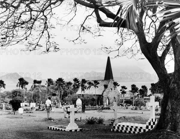 Churchyard on Nevis. A cemetery overlooking the sea on the Caribbean island of Nevis. Nevis, 1965. St Kitts and Nevis, Caribbean, North America .