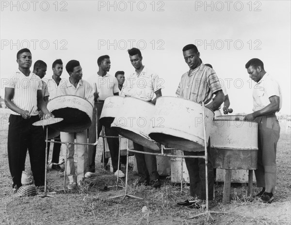 A steel band in Basseterre. A group of young men play converted petrol drums in a steel band. Basseterre, St Kitts, 1965. Basseterre, St George Basseterre, St Kitts and Nevis, Caribbean, North America .