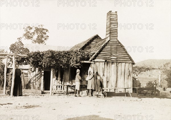 Sheep station in New South Wales . Children wash their hands a tin tub outside a ramshackle sheep station. New South Wales, Australia, 1902., New South Wales, Australia, Australia, Oceania.