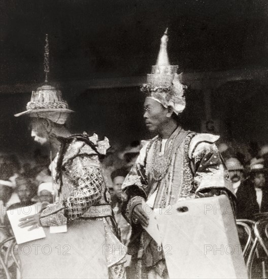 Shan chiefs at Coronation Durbar, 1903. Two elaborately dressed Shan chiefs take their seats in the pavilion to watch the parades for King Edward VII's Coronation Durbar. Delhi, India, circa 1 January 1903. Delhi, Delhi, India, Southern Asia, Asia.